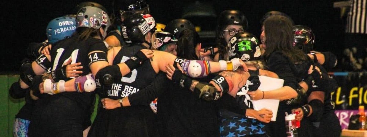 Team huddle during a bout