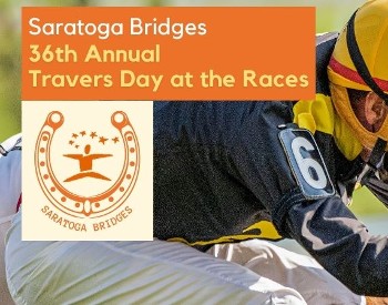 A jockey wearing a yellow hat riding a horse in a race with the Saratoga Bridges logo surrounded by a horseshoe.