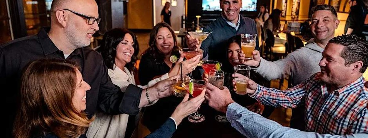 group cheers in a bar