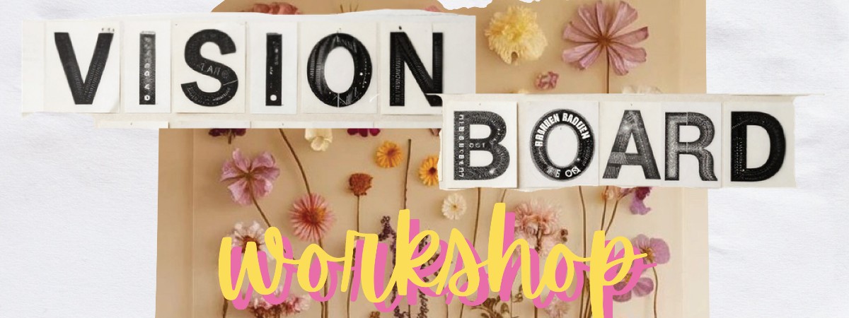 Words say Vision Board Workshop with flowers on a wooden board in the background