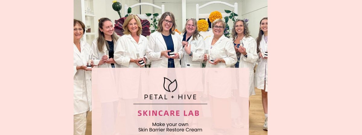 Women standing in a row wearing lab coats