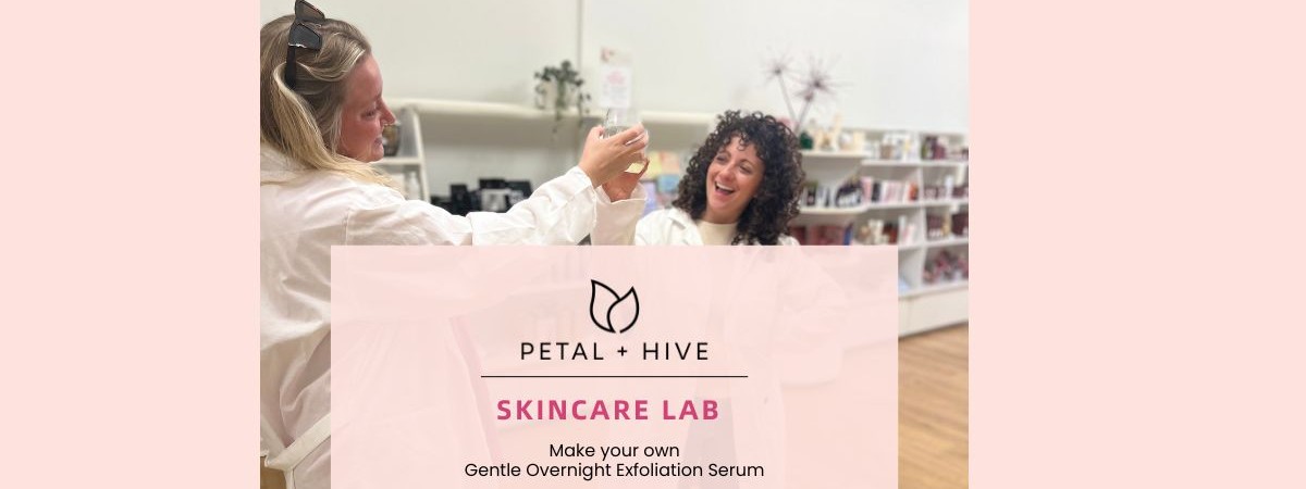 Women wearing lab coats and celebrating