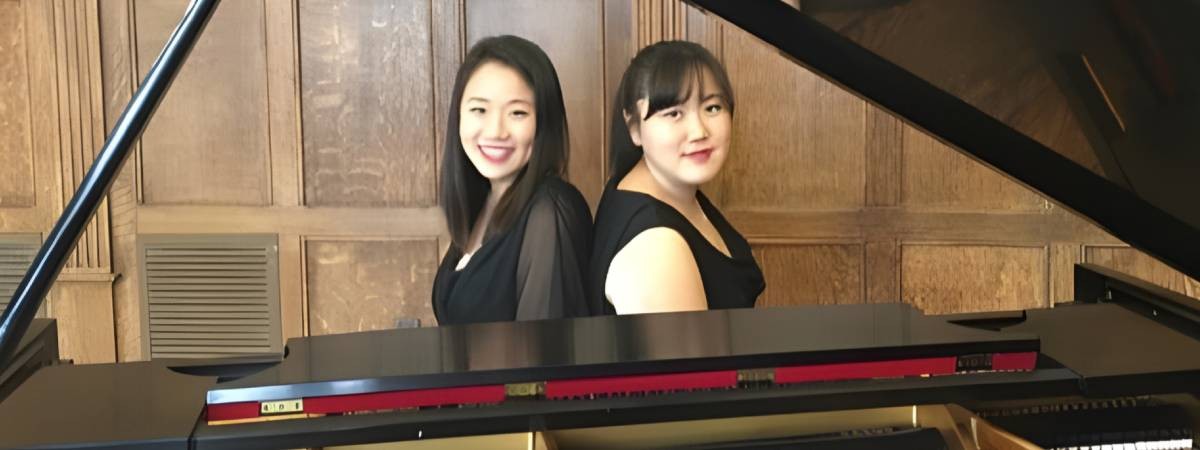 two women at piano