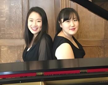 two women at piano