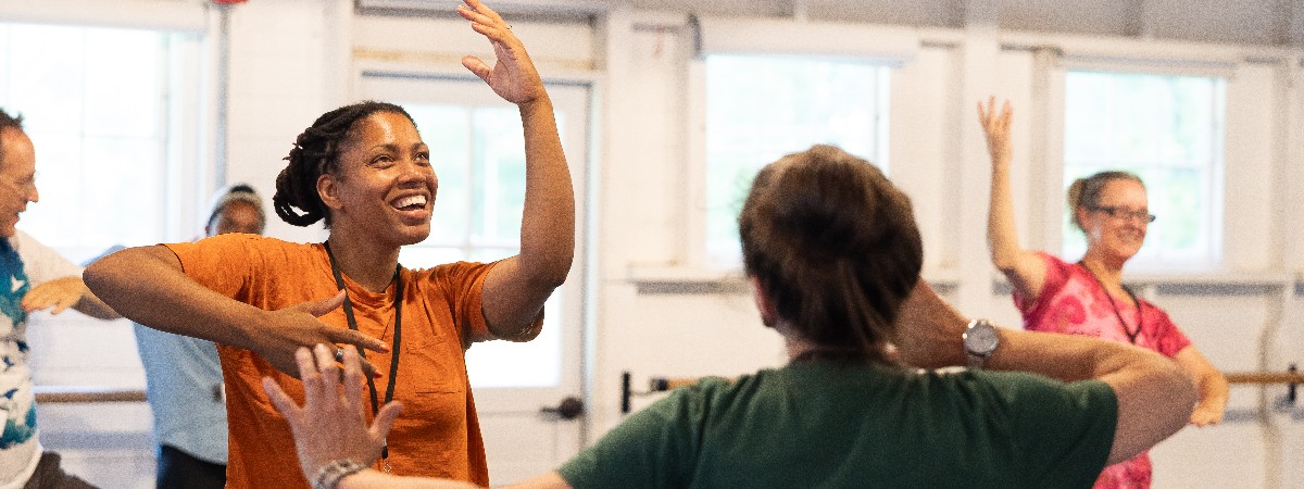 Curriculum in Motion participants dance in a well lit studio