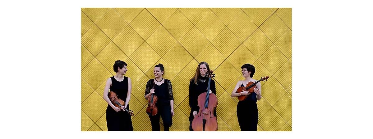 four musicians pose