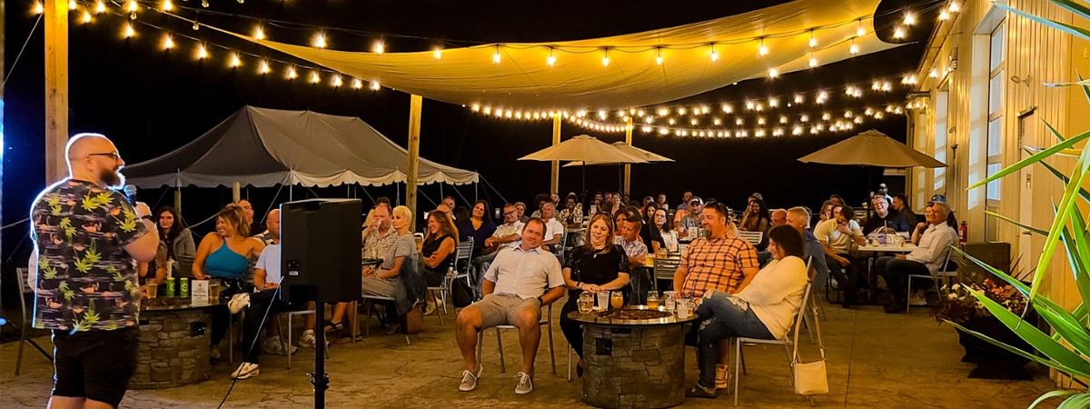 A packed comedy show at Artisanal Brew Works in Saratoga Springs featuring live stand-up and a lively crowd Stand-up comedy show with a full crowd at Artisanal Brew Works restaurant in Saratoga Springs