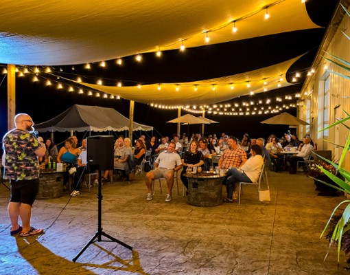 Stand-up comedy show with a full crowd at Artisanal Brew Works restaurant in Saratoga Springs
