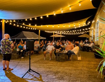 Stand-up comedy show with a full crowd at Artisanal Brew Works restaurant in Saratoga Springs