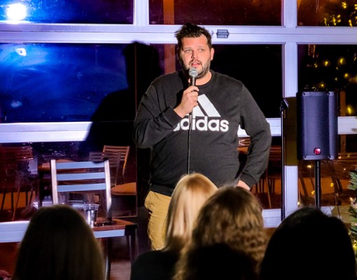 Comedian performing live stand-up comedy show at Artisanal Brew Works restaurant in Saratoga Springs