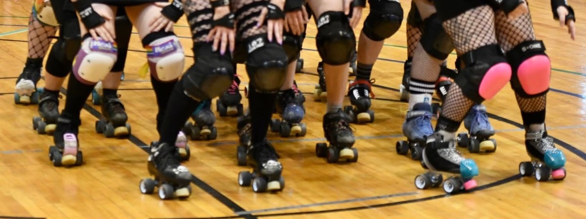 Several roller derby skaters in a group