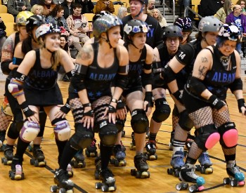 Several roller derby skaters in a group