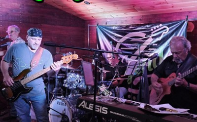 A band sings and plays