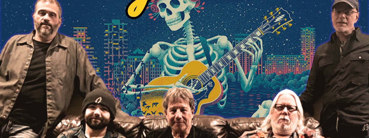 A band poses for a photo in front of a Grateful Dead mural