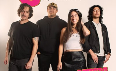 A 4-piece band poses for a photo