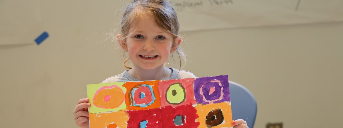 student with artwork at The Hyde Collection
