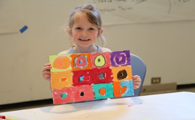 student with artwork at The Hyde Collection