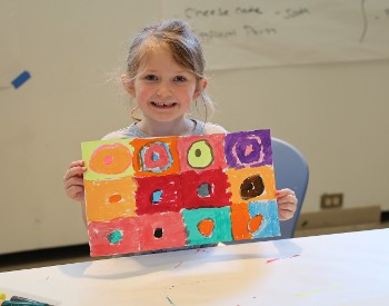 student with artwork at The Hyde Collection