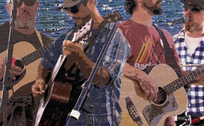 A band plays guitars in front of a sparkling lake