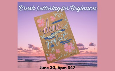 Pink background with pink sunset in background and a book that is hand lettered "Done is better than perfect"