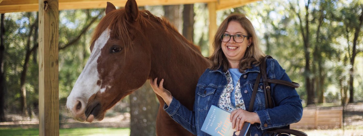 author Natalie Keller with a horse