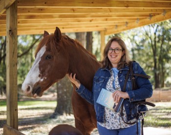 author Natalie Keller with a horse