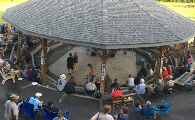 group under a large gazebo for an event
