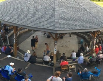 group under a large gazebo for an event