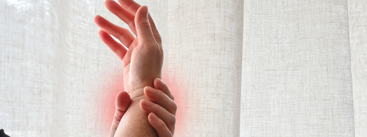 a person holding their wrist
