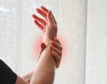a person holding their wrist