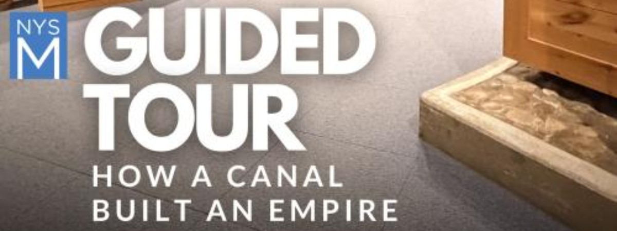 Guided Tour How a Canal Built an Empire text with wooden shipping boxes.