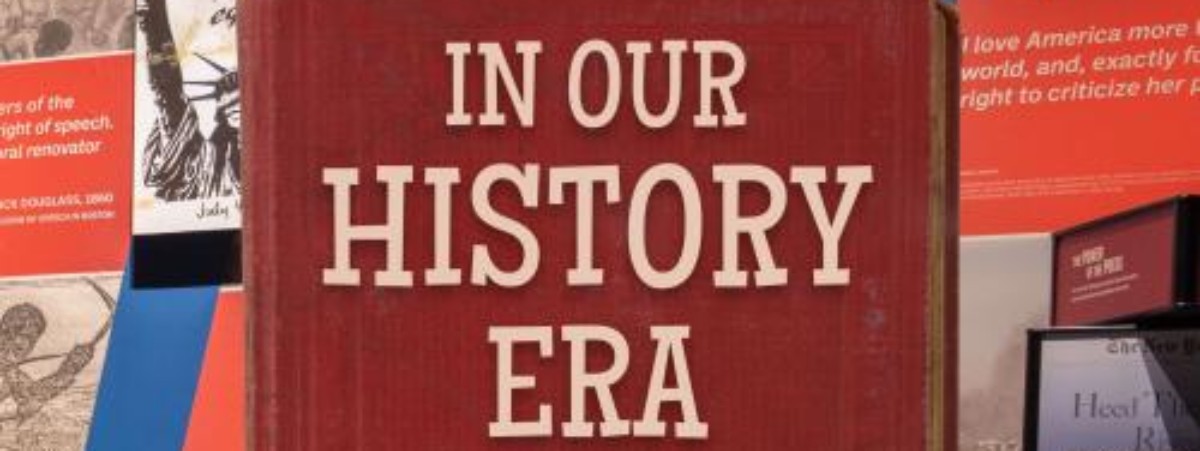 In Our History Era text with historical posters in the background.