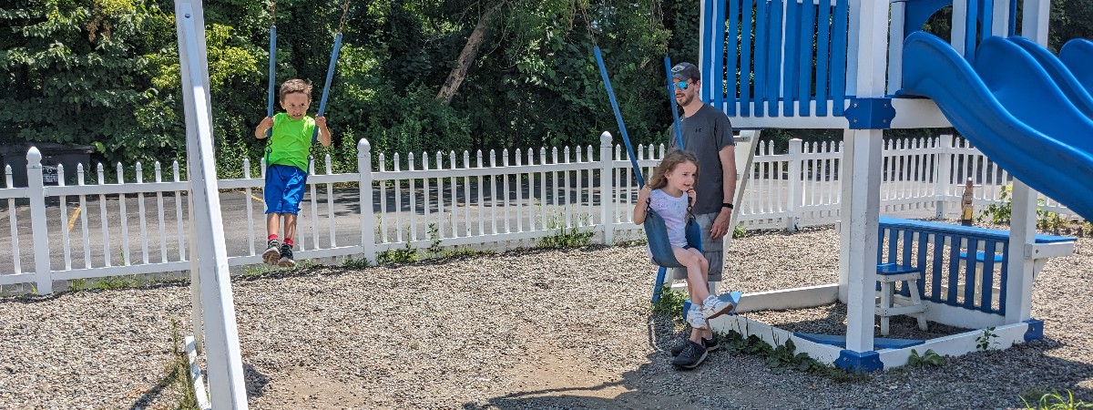 kids and dad at playground