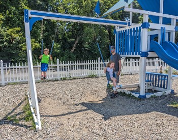 kids and dad at playground