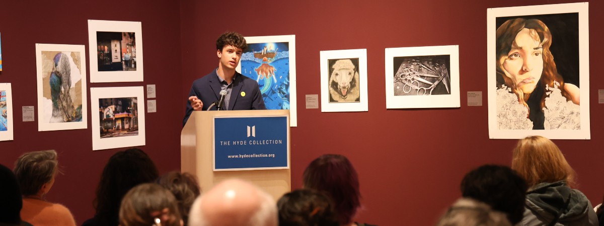 Student reading artist statement at The Hyde Collection.