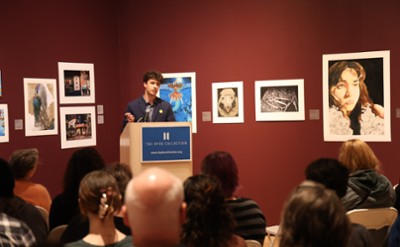 Student reading artist statement at The Hyde Collection.