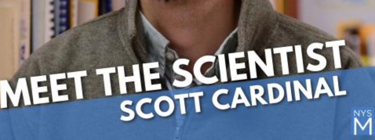 Picture of man wearing collared shirt in background with text in forefront stating: Meet the Scientist Scott Cardinal