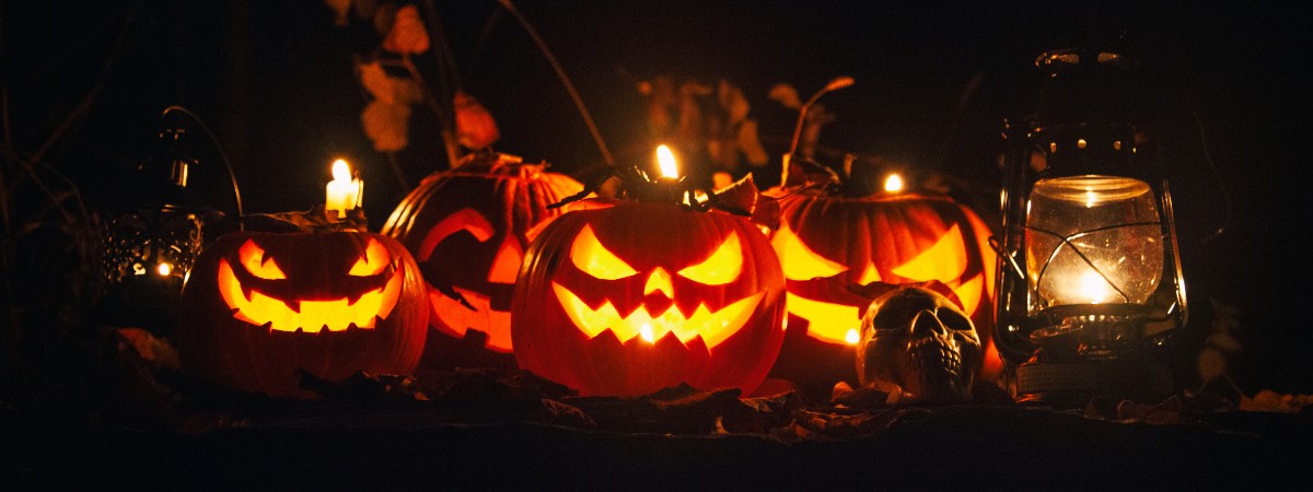 Glowing carved jack-o-lanterns displayed at Night of the Jack-o-Lanterns at Artisanal Brew Works in Saratoga Springs.