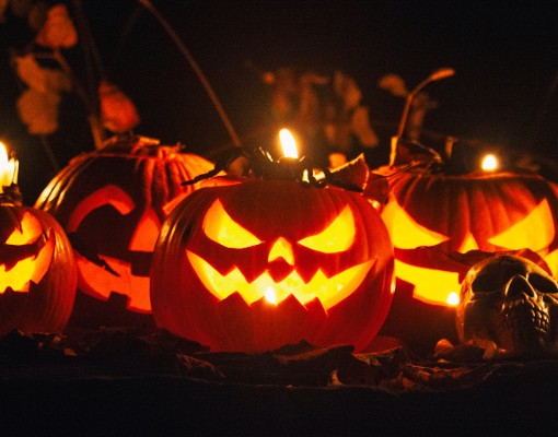 Glowing carved jack-o-lanterns displayed at Night of the Jack-o-Lanterns at Artisanal Brew Works in Saratoga Springs.