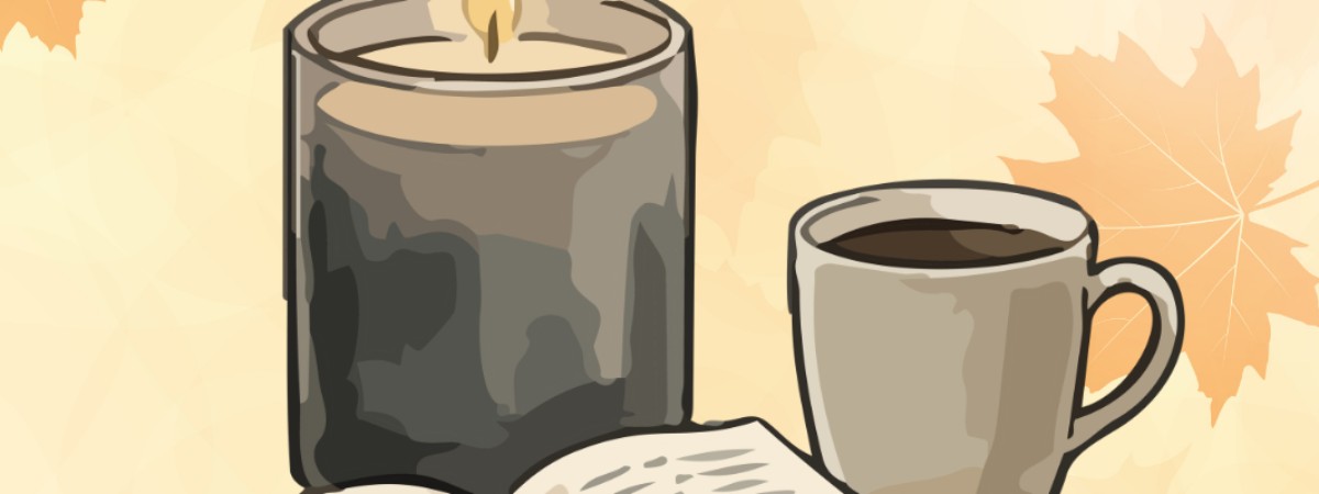 Candle coffee and open book