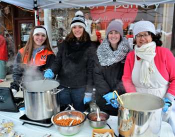 four women at Chowderfest table