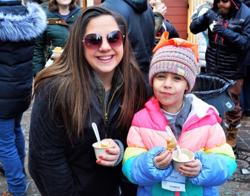 woman and girl with chowder samples