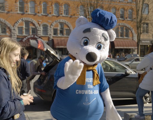 person dressed in a polar bear outfit