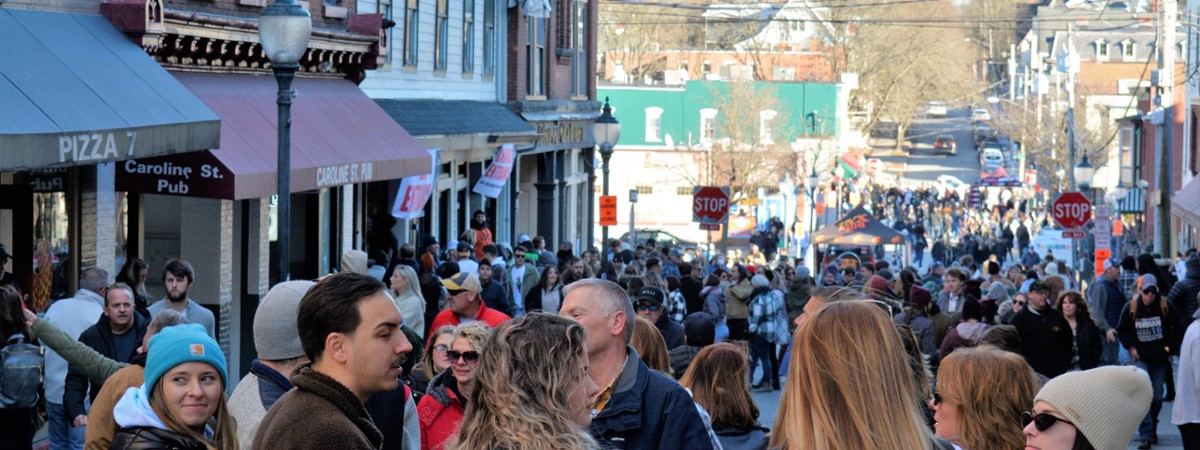 crowd of people at an event in a city