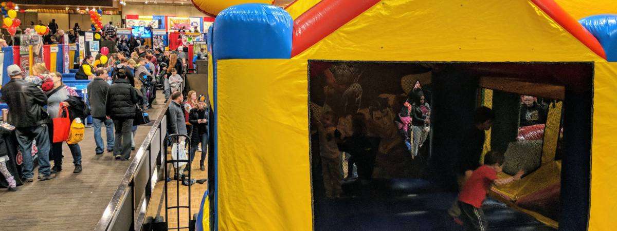 bounce house and crowd at kidz expo