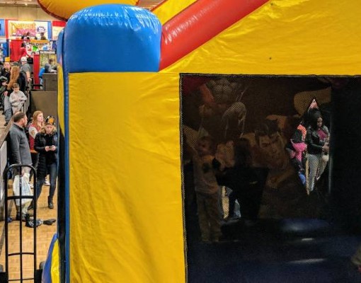 bounce house and crowd at kidz expo
