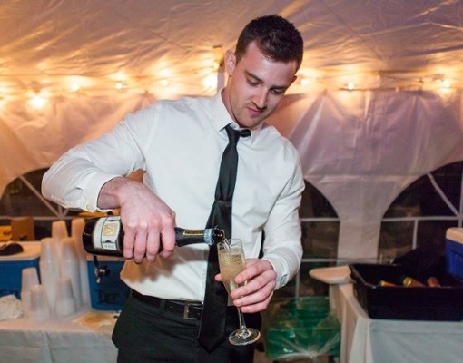 man pouring champagne