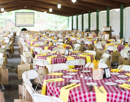 group of tables with red and white checkered tablecloths
