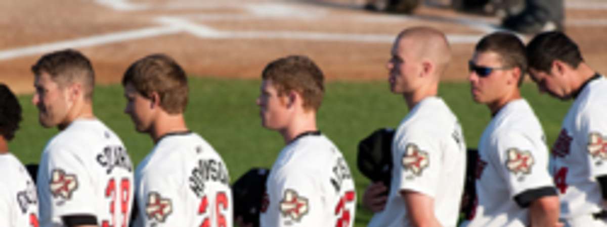 baseball players standing for national anthem