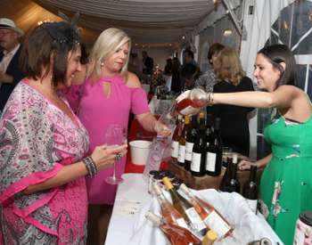 three women at a wine tasting